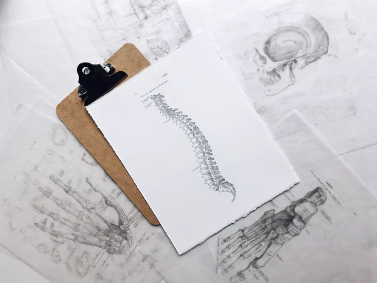 A clipboard with a drawing of a skeleton at home illustrating get back to active, get back to health!